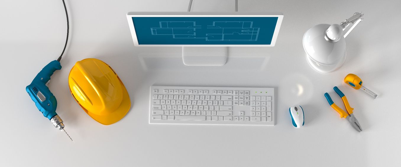 Immobilienwirtschaft Studium – Gegenstaende liegen auf einem Schreibtisch neben einem Computer